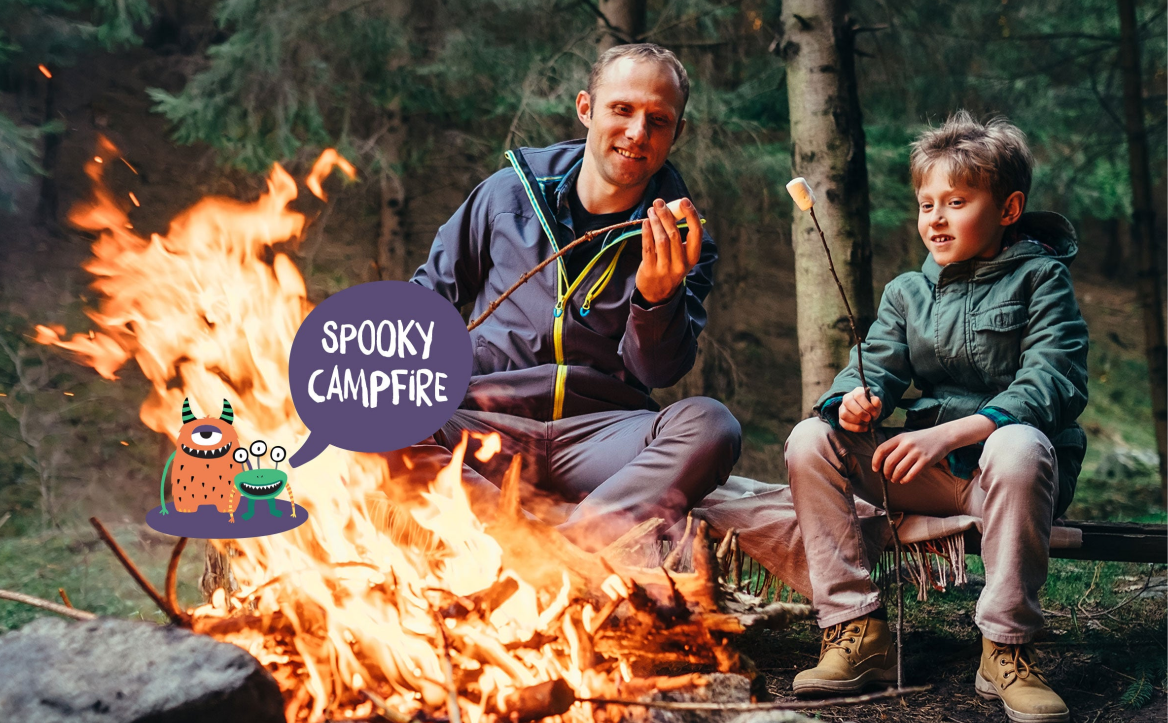 Father and son are sitting and enjoying themselves by a campfire.
