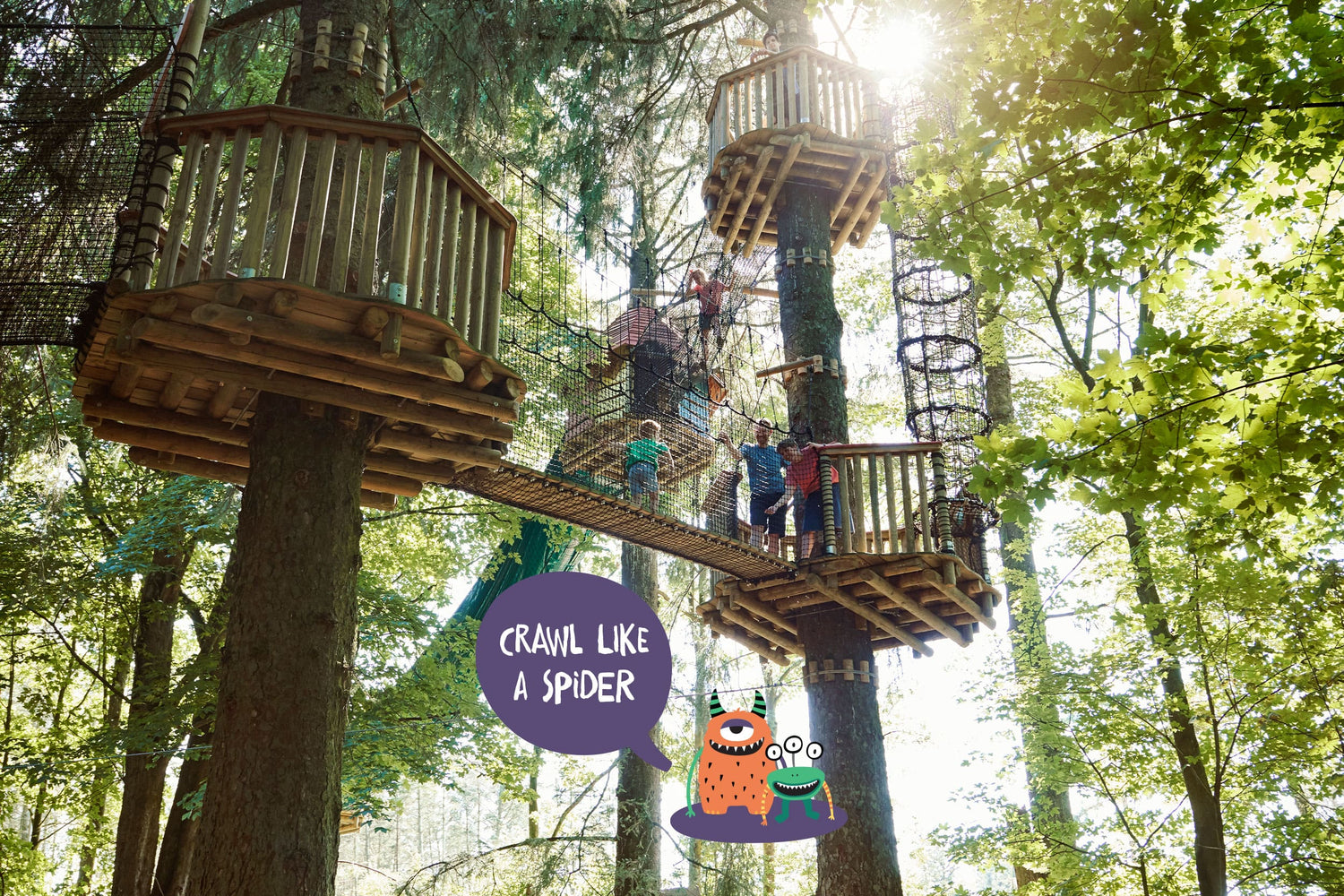 A net walkway high up in the air with people on it.