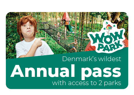 You see a boy pointing at the attractions in WOW PARK. A graphic displays “Annual Pass” with text.