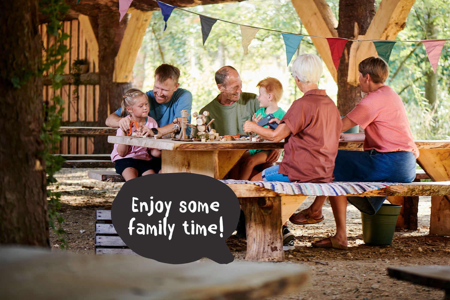 A whole family, including grandparents, mother, father, and children, is enjoying themselves at WOW PARK.